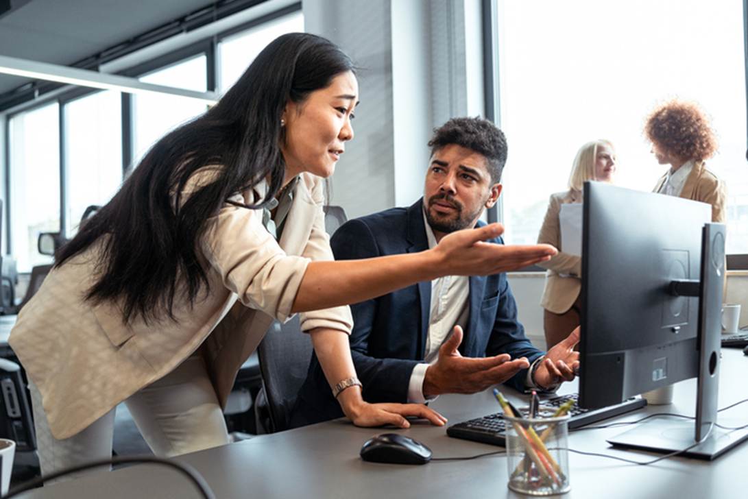 A person pointing at a computer screen
AI-generated content may be incorrect.